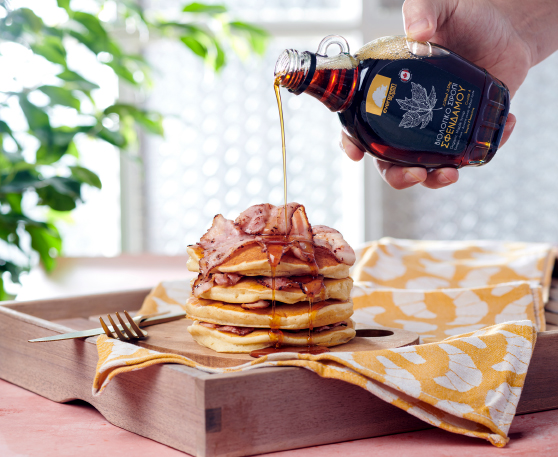 Pancakes with grilled bacon and maple syrup